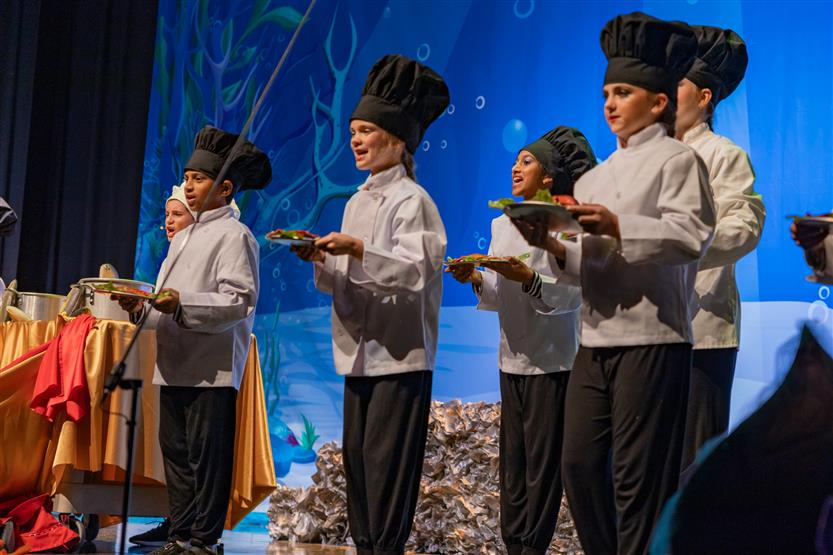 Students perform onstage